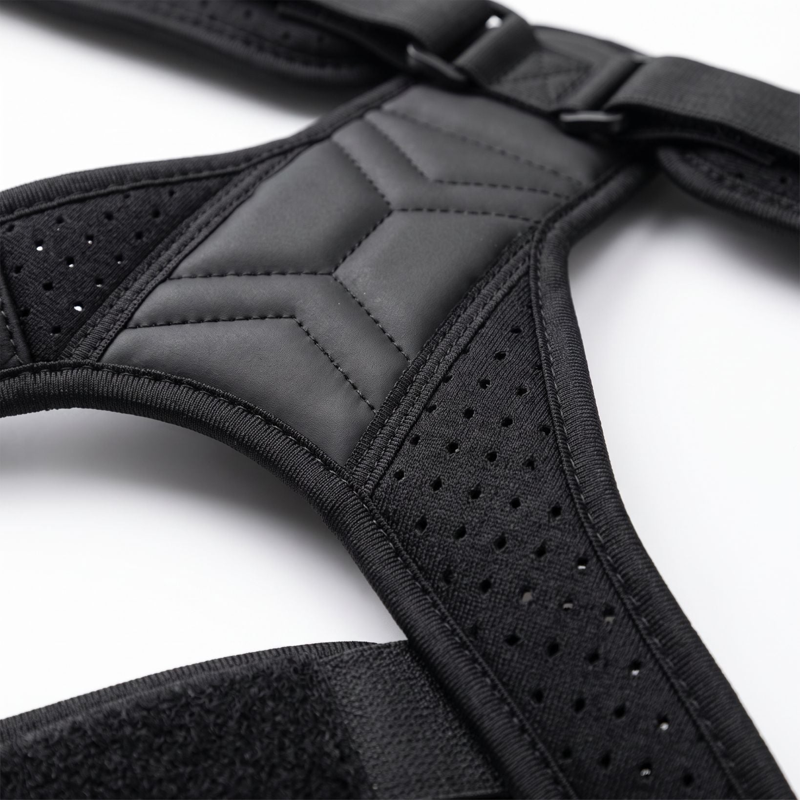 Close-up of the breathable perforated mesh on the black ExoPosture Air posture corrector. black-air1 black-air2 black-air3 black-air4 black-air5