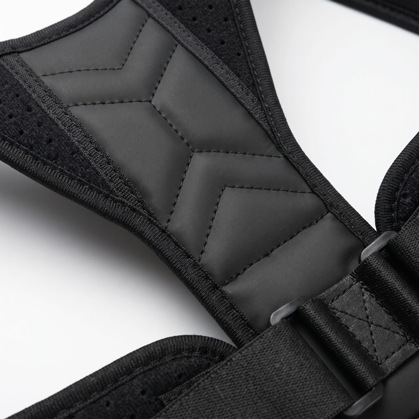 Close-up of the flat back pad and adjustable buckle on the black ExoPosture Air posture corrector. black-air1 black-air2 black-air3 black-air4 black-air5