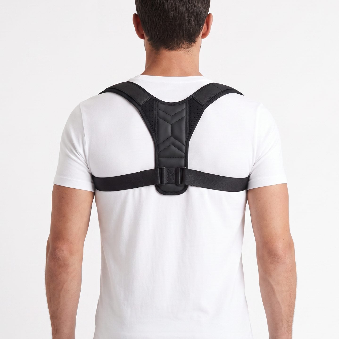 Man wearing the black ExoPosture Air posture corrector, back view showing the strap fit across the shoulders. black-air1 black-air2 black-air3 black-air4 black-air5