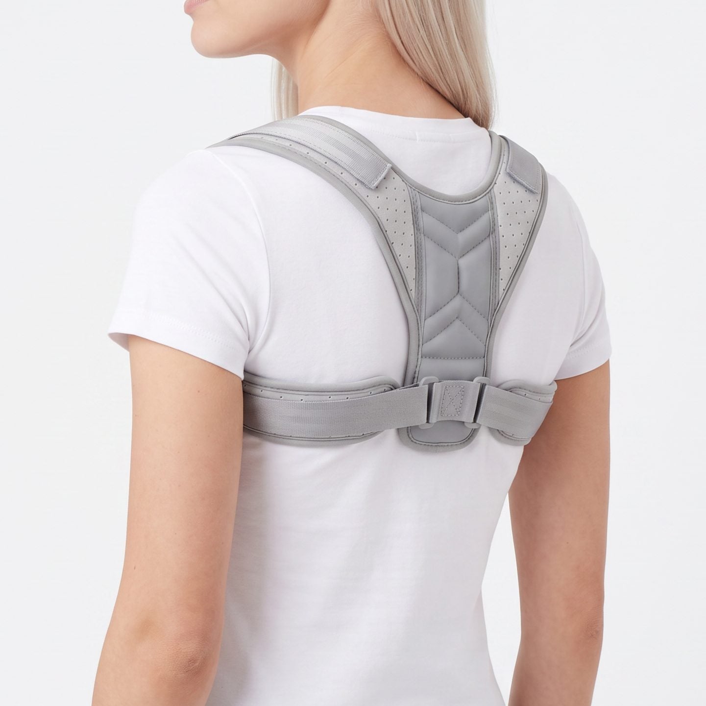 Woman wearing the gray ExoPosture Air posture corrector, three-quarter back view. gray-air1 gray-air2 gray-air3 gray-air4 gray-air5