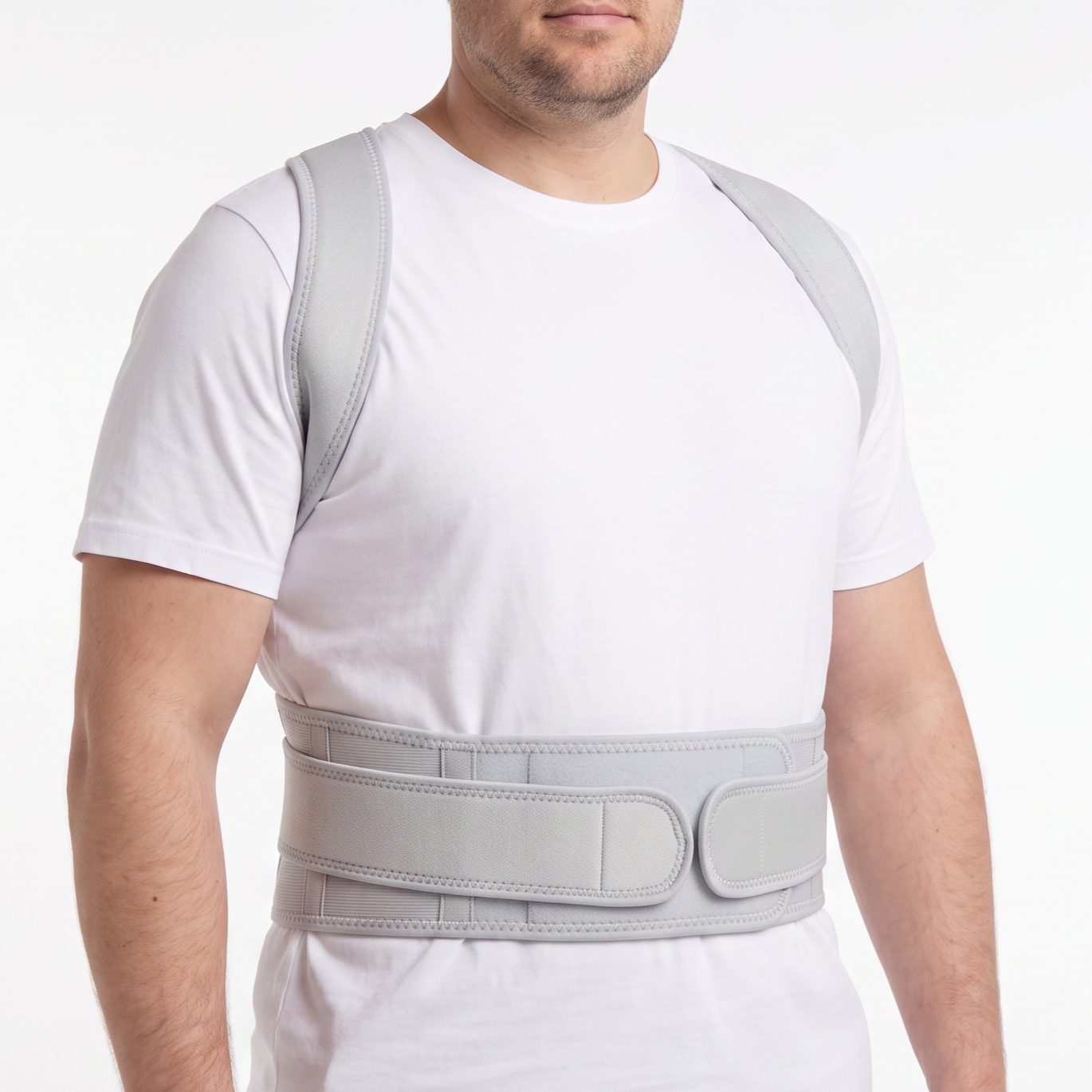 Man wearing the grey ExoPosture Max full back posture corrector, front view.